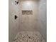 Custom tiled shower with decorative inlay and modern fixtures at 262 Locust Rd, Ocala, FL 34472