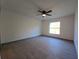 Bedroom with ceiling fan and large window at 262 Locust Rd, Ocala, FL 34472