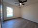 Simple bedroom with large window and ceiling fan at 262 Locust Rd, Ocala, FL 34472