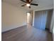 Spacious bedroom with ceiling fan and grey doors at 262 Locust Rd, Ocala, FL 34472