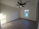 Spacious bedroom with large window and ceiling fan at 262 Locust Rd, Ocala, FL 34472