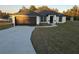 New home with a dark brown garage door at 262 Locust Rd, Ocala, FL 34472