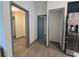 Hallway with grey doors and wood-look flooring at 262 Locust Rd, Ocala, FL 34472