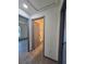 Hallway with doors leading to various rooms, showcasing the home's layout at 262 Locust Rd, Ocala, FL 34472