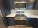 Close up of new stainless steel range and microwave in modern kitchen at 262 Locust Rd, Ocala, FL 34472