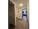 Laundry room with wire shelving and a view through the doorway into the kitchen at 262 Locust Rd, Ocala, FL 34472