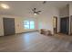 Living room with grey door and wood-look floors at 262 Locust Rd, Ocala, FL 34472