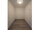 Small storage room with wood-look flooring at 262 Locust Rd, Ocala, FL 34472