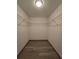 Bright walk-in closet with wire shelving and wood-look floors at 262 Locust Rd, Ocala, FL 34472