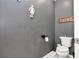 Small powder room with toilet and decorative wall art at 2936 Ne 43Rd Rd, Ocala, FL 34470