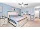 Spacious bedroom with a large bed, dresser, and ceiling fan at 2936 Ne 43Rd Rd, Ocala, FL 34470