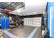 Garage with overhead storage and epoxy flooring at 2936 Ne 43Rd Rd, Ocala, FL 34470