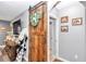 A home interior featuring a barn door, hardwood floors, and a gray wall at 2936 Ne 43Rd Rd, Ocala, FL 34470