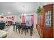 Bright dining room with a dark wood table and red curtains at 38 Spring Trce, Ocala, FL 34472