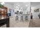 Modern kitchen featuring white cabinets and a breakfast bar at 38 Spring Trce, Ocala, FL 34472