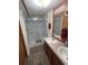 Clean bathroom with a walk-in shower and dual sinks at 3899 Se 80Th St, Ocala, FL 34480