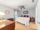 Main bedroom with king-size bed and wood furniture at 3899 Se 80Th St, Ocala, FL 34480