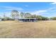 Mobile home with covered porch and large yard at 3899 Se 80Th St, Ocala, FL 34480