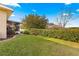 Landscaped backyard with a screened patio and lush lawn at 4 Diamond Cove Ct, Ocala, FL 34472