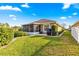 Backyard view of patio and screened enclosure at 4 Diamond Cove Ct, Ocala, FL 34472