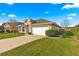 One-story house with a large grassy yard and attached garage at 4 Diamond Cove Ct, Ocala, FL 34472