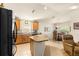 Bright kitchen with an island, granite countertops, and black appliances at 4 Diamond Cove Ct, Ocala, FL 34472