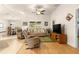 Comfortable living room featuring hardwood floors and a ceiling fan at 4 Diamond Cove Ct, Ocala, FL 34472