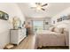 Spacious main bedroom with king-size bed and white dresser at 4 Diamond Cove Ct, Ocala, FL 34472