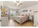 Bright main bedroom with king-size bed and white dresser at 4 Diamond Cove Ct, Ocala, FL 34472