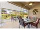 Relaxing screened porch with seating area and ceiling fan at 4 Diamond Cove Ct, Ocala, FL 34472