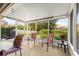 Relaxing screened porch with patio furniture, overlooking backyard at 4 Diamond Cove Ct, Ocala, FL 34472