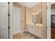 Tiled half bathroom featuring vanity with white cabinets and marble countertop at 4020 Se 9Th Ave, Ocala, FL 34480