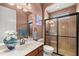 Elegant bathroom with a glass-enclosed shower, marble countertop, and decorative accents at 4020 Se 9Th Ave, Ocala, FL 34480