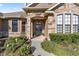 Inviting home exterior with stone accents and landscaped yard at 4020 Se 9Th Ave, Ocala, FL 34480