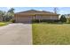 Home exterior showcasing a two-car garage and driveway at 4020 Se 9Th Ave, Ocala, FL 34480