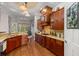 Modern kitchen with wood cabinets and granite countertops at 4020 Se 9Th Ave, Ocala, FL 34480