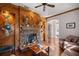 Living room featuring a stone fireplace and wood accents at 4020 Se 9Th Ave, Ocala, FL 34480