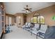 Screened patio with seating area and ceiling fan at 4020 Se 9Th Ave, Ocala, FL 34480