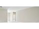 Neutral-toned hallway with doors to other rooms and light gray walls at 5185 Sw 155Th Loop Rd, Ocala, FL 34473