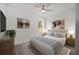 Bedroom featuring neutral decor, a ceiling fan and a picture window at 5200 Nw 54Th Pl, Ocala, FL 34482