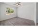 Minimalist bedroom with natural light, sleek flooring, and a spacious layout at 5200 Nw 54Th Pl, Ocala, FL 34482