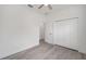 Empty bedroom with wood floors, baseboard trim, and a closet at 5200 Nw 54Th Pl, Ocala, FL 34482