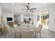 Bright dining area with modern furnishings, sliding glass doors, and seamless flow to the kitchen at 5200 Nw 54Th Pl, Ocala, FL 34482