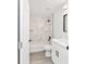 Modern bathroom showcasing a tiled shower and a vanity with a black hardware and faucet at 55 Locust Loop Cir, Ocala, FL 34472