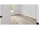 Cozy bedroom with wood floors and a window offers a comfortable and inviting space at 55 Locust Loop Cir, Ocala, FL 34472