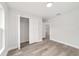 Bedroom with wood flooring offers plenty of closet space at 55 Locust Loop Cir, Ocala, FL 34472