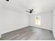 Spacious bedroom with gray vinyl flooring and a large window at 55 Locust Loop Cir, Ocala, FL 34472