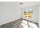 Bright bedroom featuring a large window and grey vinyl flooring at 55 Locust Loop Cir, Ocala, FL 34472