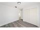 Bedroom with double door closet and grey vinyl flooring at 55 Locust Loop Cir, Ocala, FL 34472