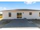 Rear view of house showing patio and surrounding land at 55 Locust Loop Cir, Ocala, FL 34472